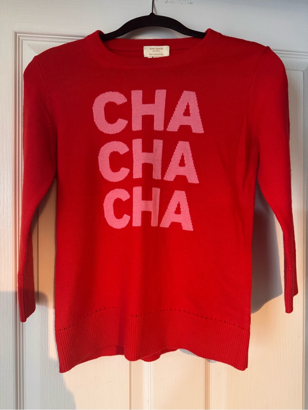 kate spade red crewneck sweater with pink CHA CHA CHA graphic